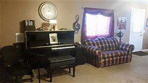 This is the Yamaha piano my parents made monthly payments on when I was in high school so I could have a quality instrument to practice on. This piano is used for two piano duets.